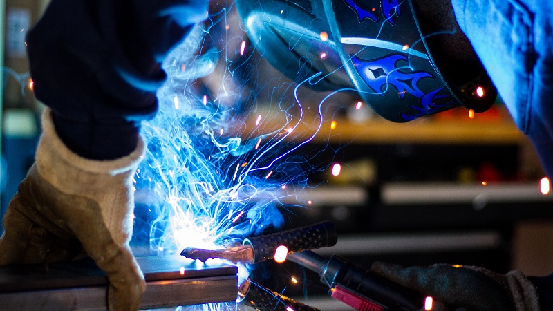 Man welding showing production in action