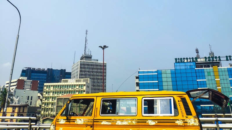A yellow ink front of city buildings in Lagos, Nigeria