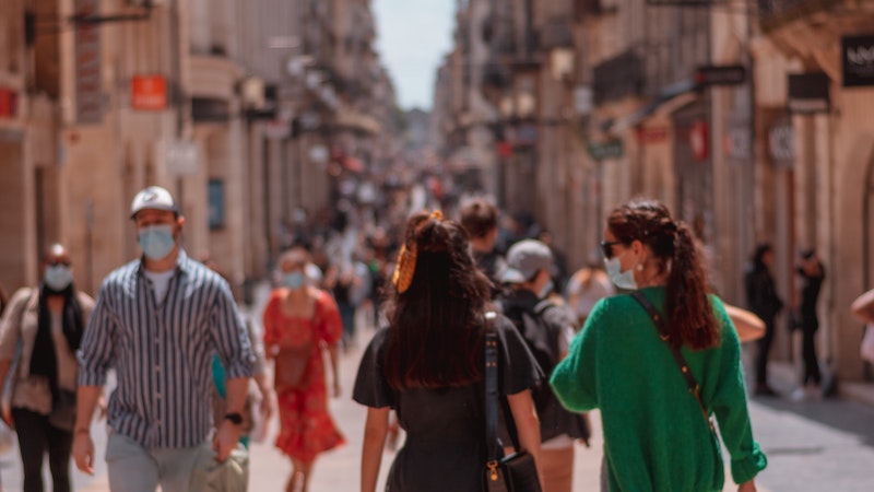 Pedestrians with masks walking through Bordeaux during the coronavirus pandemic