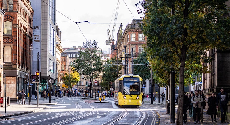 Tram moving through the streets of Manchester