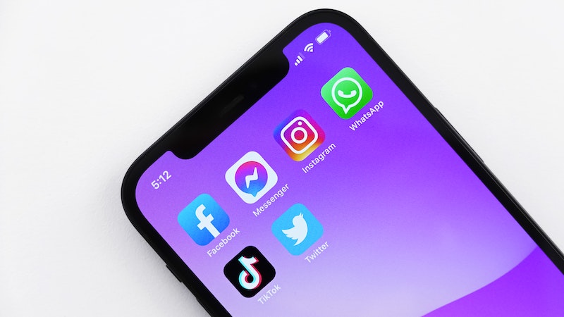 Phone with various social media apps, including Facebook, Instagram, WhatsApp, TikTok and Twitter