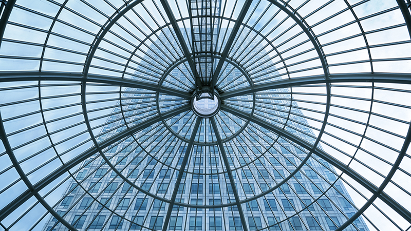 Glass ceiling looking onto a bigger office building