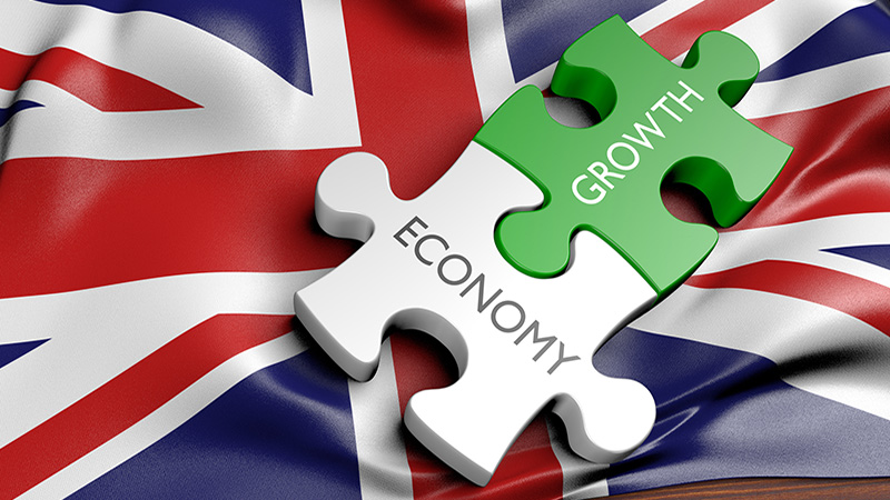 Picture of a Union Jack with jigsaw pieces titled economy and growth slotted together