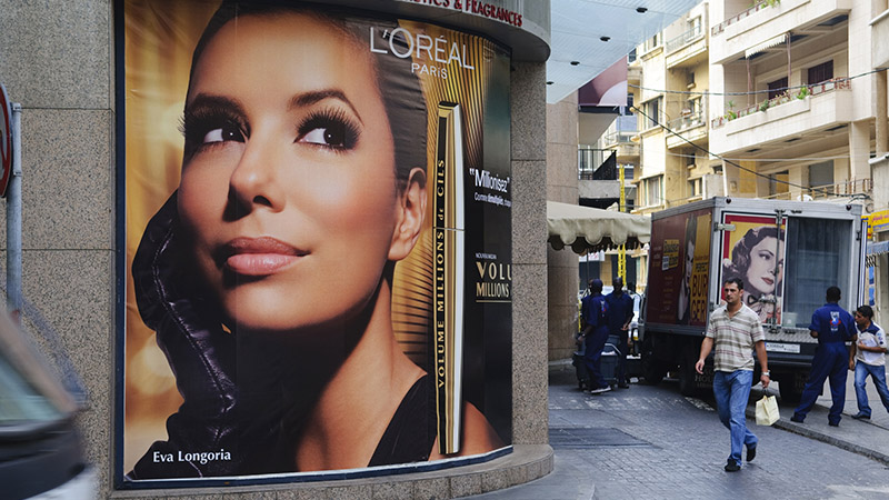 Beirut, Lebanon - September 22, 2010: A L'Oreal mascara advertisement featuring Eva Longoria is displayed on a corner of popular Hamra Street.