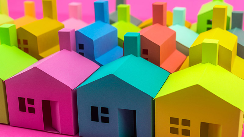 Pick your home. Group of multicolored houses on sale.