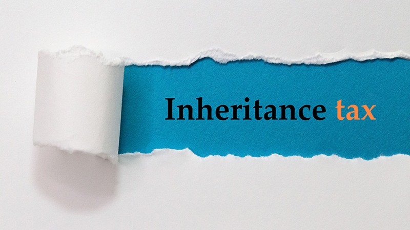 Inheritance Tax Written Under White Torn Paper