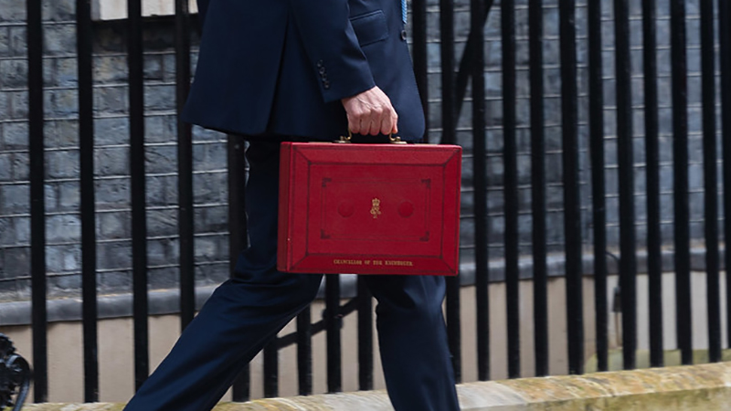 London, United Kingdom. The Chancellor of the Exchequer Jeremy Hunt poses outside 11 Downing Street with the Red Box, alongside the other Treasury ministers, before he delivers the Budget to parliament. 10 Downing Street. Picture by Simon Walker / No 10 Downing Street