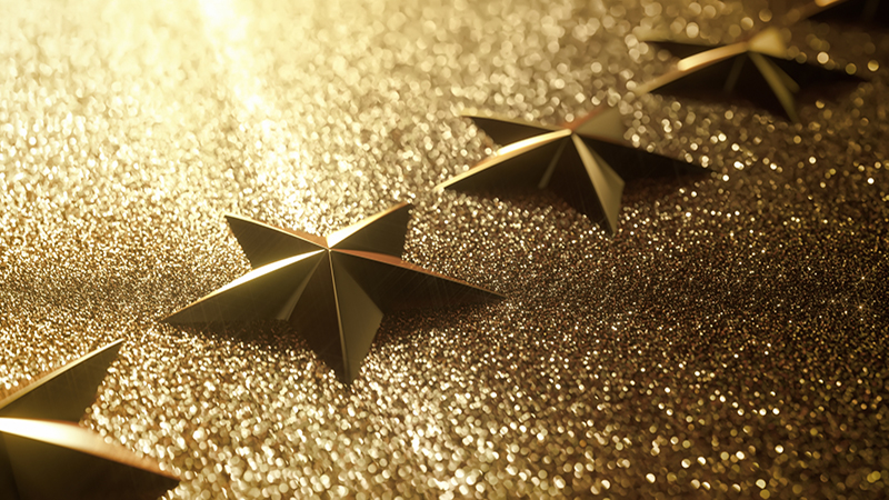 Golden stars in high relief. Concept of good qualification.