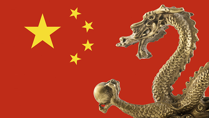 Chinese golden dragon statue on Chinese flag