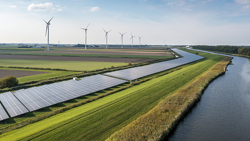 Solar panels and wind turbines generating renewable energy for green and sustainable future.