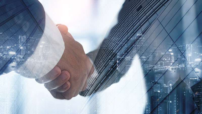 Double exposure of business handshake for successful of investment deal and the city, business teamwork and partnership concept. Businessmen making a handshake, business finanace and investment background