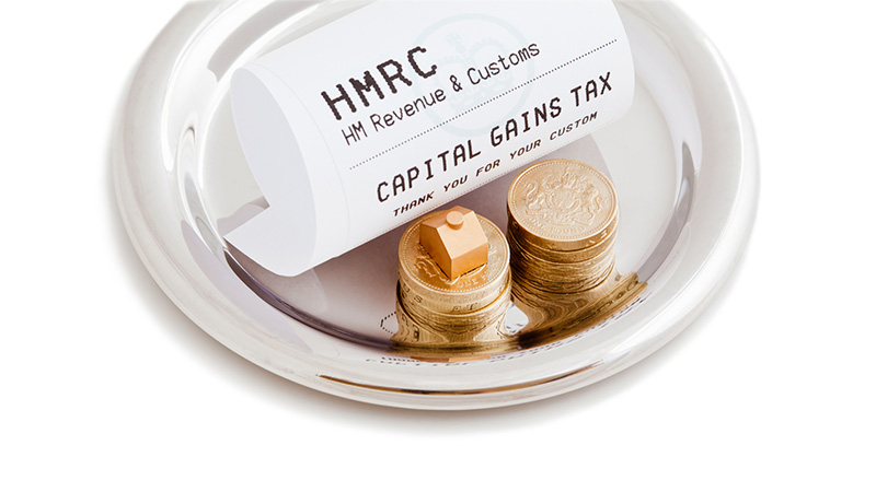 "In the UK, the annual tax-free allowance, known as the Annual Exempt Amount, allows an individual to make a certain amount of capital gains each tax year before you have to pay any tax. The amount allowed for 2011, 2012 tax year is A#10,600 per individual. Individualaas home residences are exempt from the tax, but all other property and all other asset sales are subject to the annual tax threshold. Good planning can help to minimize the tax paid to Her Majestyaas Revenue and Customs. This tax is symbolized with an HMRC till receipt on a waiteraas tray, with pound coins and a symbolic model property