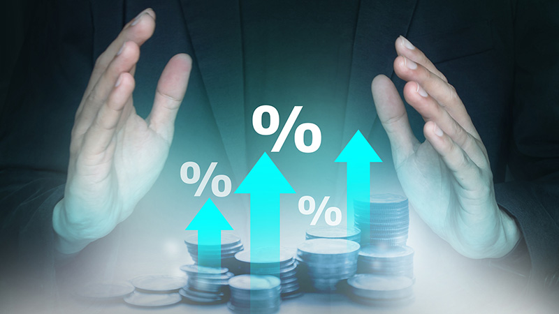 Interest rate increasing concept; Percentage symbol and arrow up sign with stack of coins