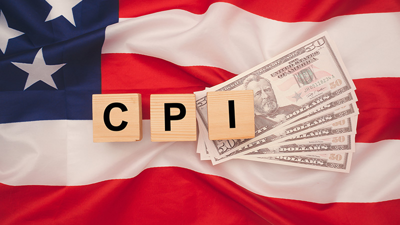 Consumer Price Index concept. Wooden cubes with the letters CPI on the American flag background.