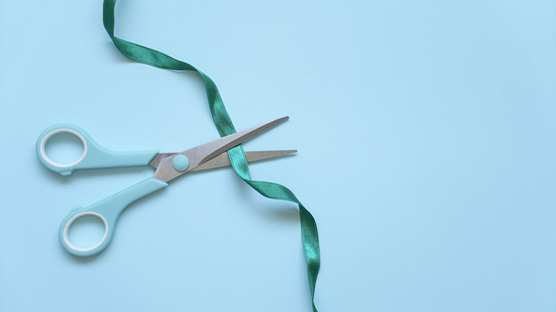 scissors cutting a ribbon.